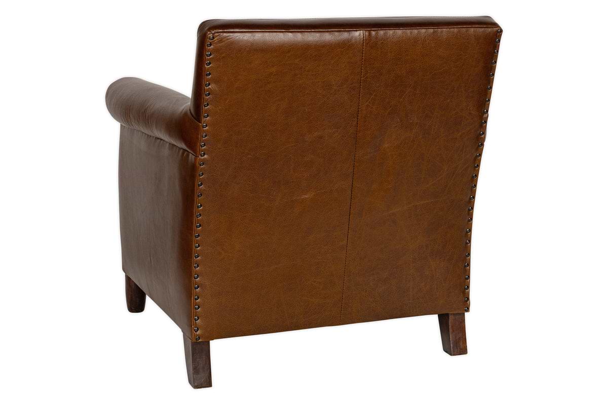 The nkuku Knada Leather Armchair in chocolate brown is shown from the back, featuring walnut-stained feet and decorative metal studs along the sides and top edges.