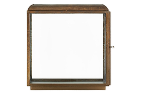 The Kiwanda Tall Lantern by nkuku features an antique brass finish, clear glass panels, a flat base, and a rounded top. It’s ideal for candlelight décor and has a side latch to open the front door.