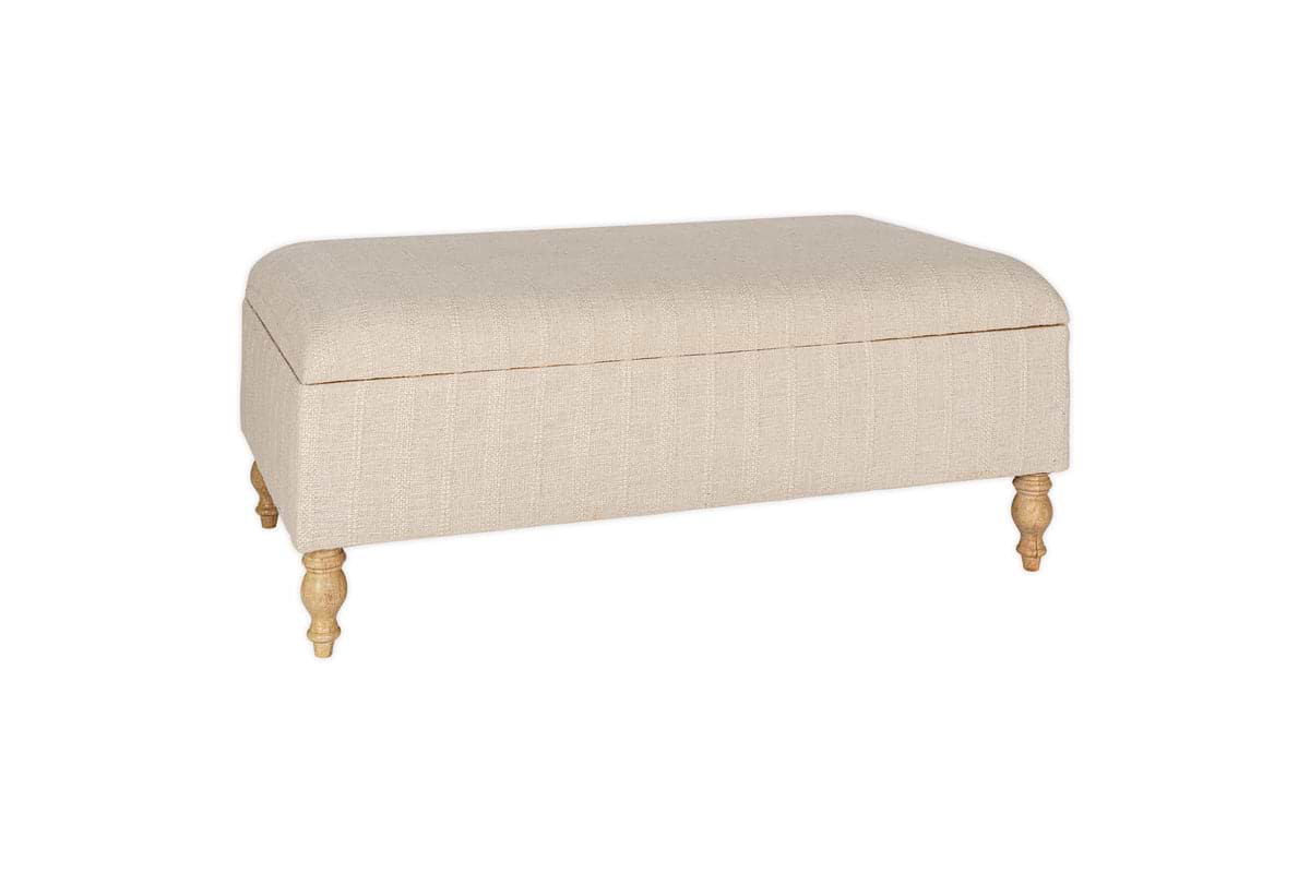 The Kiana Upholstered Storage Ottoman by nkuku features a natural beige finish, cushioned top, and four light wooden legs—perfect as a footrest or extra seating in your living space, shown here against a white background.