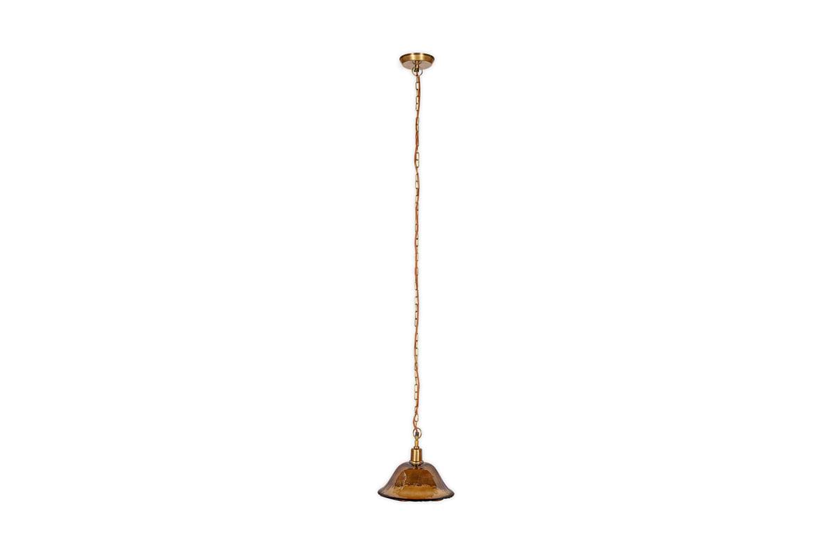 The nkuku Keju Organic Shape Recycled Glass Pendant in Dark Amber features a small brown glass shade, antique brass chain, and gold ceiling mount, shown here suspended against a white background.