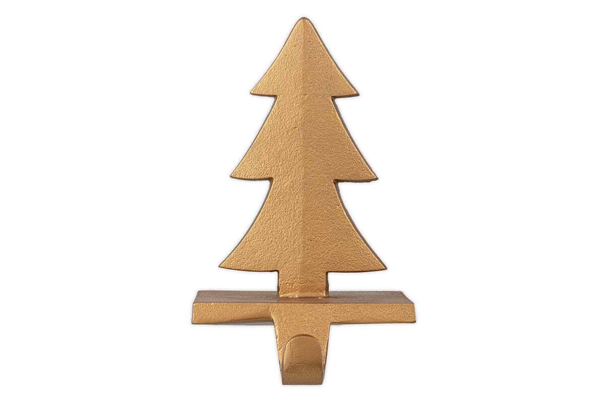 The nkuku Kotta Stocking Tree Holder in antique brass features a stylized Christmas tree design with three layered branches and a rectangular base, making it a festive and elegant way to hang stockings on your mantel.
