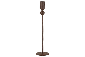 The Mawindi Candle Holder - Rust by nkuku is a tall, slender iron piece with a round base and minimalist design—ideal for adding rustic charm to earthy decor.