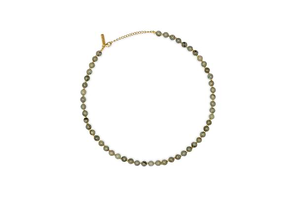 The nkuku Marai Necklace - Labradortite features a single strand of round, gray-green labradorite beads with a gold chain and adjustable clasp, displayed on a white background—an elegant accessory for any occasion.