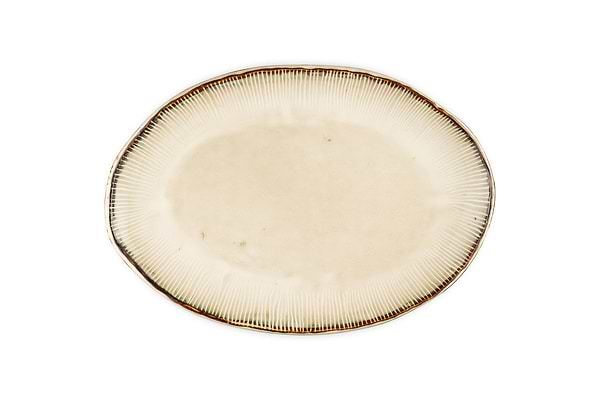 The nkuku Malia Large Oval Platter - Cream features an organic oval shape, cream center, subtle textured lines radiating outward, and a slightly darker irregular rim. The empty ceramic platter is set against a white background.