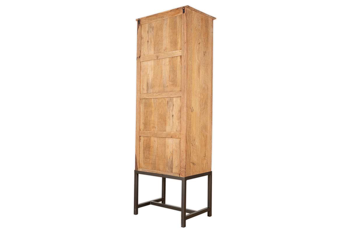 The nkuku Nirvi Mango Wood & Iron Tall Cabinet - Black features a tall, rectangular design with a single door, natural finish, and stands on a four-legged black metal frame.