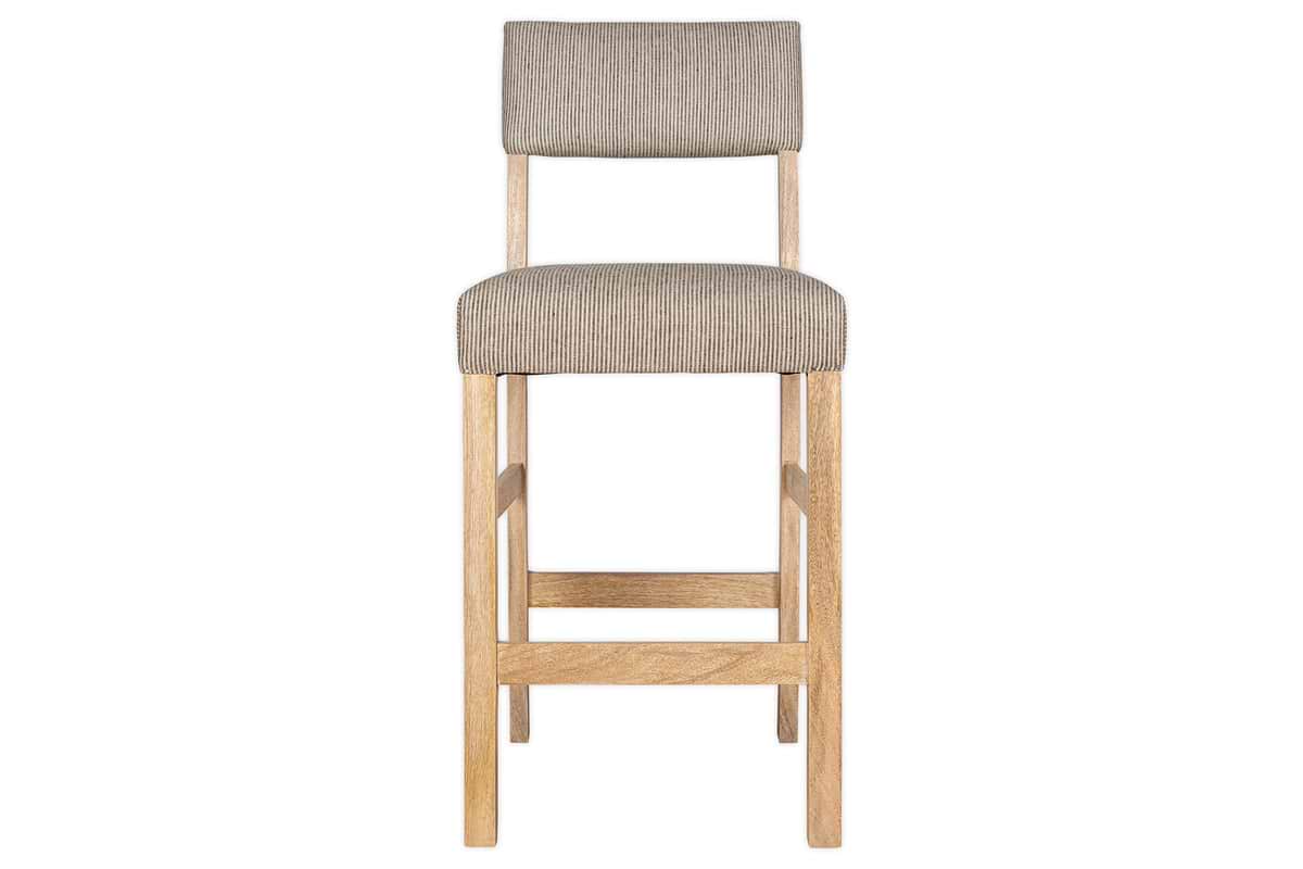 The nkuku Nadeeka Linen Upholstered Counter Chair in Soft Grey features a simple, modern design with a natural wood frame and legs. Its soft grey linen seat and backrest are shown from the front against a white background—ideal for kitchen islands.