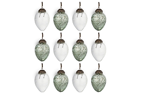 The nkuku Enia Mini Hanging Egg Decoration set includes 12 vintage-style ornaments in antique teal and clear, each with an antique brass cap and brown loop, arranged in a 3x4 grid against a white background.