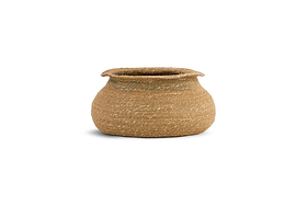 The nkuku Rana Short Basket - Natural & Moss features a wide, round woven design with a slightly tapered opening and flared rim. Crafted from light brown seagrass fibers, it brings textured charm to any natural home decor.