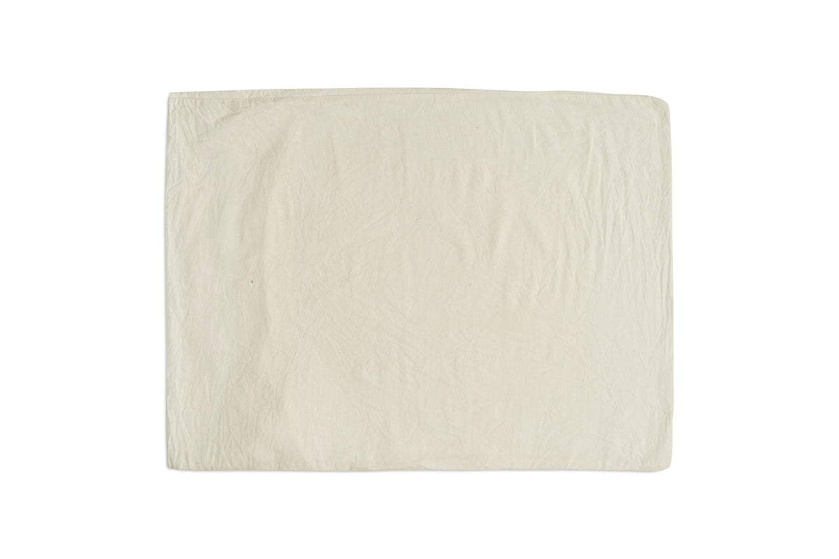 The Cela Hemp & Cotton Duvet Cover by nkuku, shown in natural beige with neat stitching and soft creases against a white background, offers a clean, sustainable look—an ideal neutral piece for eco-friendly bedding.