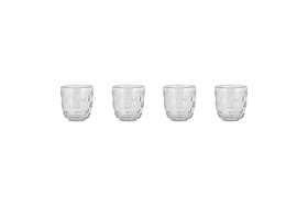 Four nkuku Kaanch Tumblers (Set of 4, Clear) are arranged in a horizontal row on a white background, each empty and evenly spaced. The glass tumblers feature an embossed check pattern with a textured geometric design.