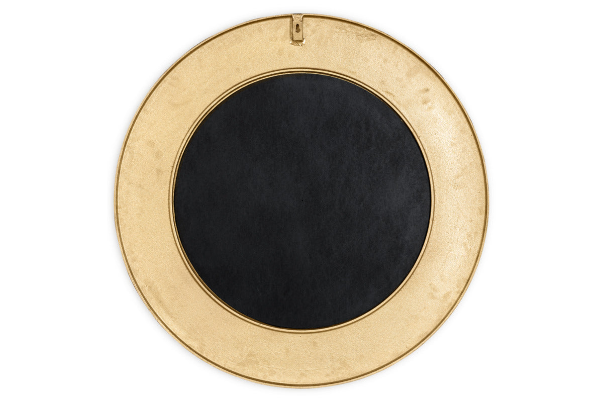 The Moto Round Mirror by nkuku features an antique brass finish and a wide border, with a small hanging hook at the top. This minimalist mirror rests against a plain white background, perfect for elegant decor.