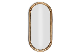 The Mbwa Oval Mirror by nkuku features a reflective surface and an antique brass, textured frame, shown against a plain white background.