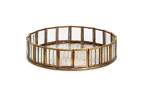 The Ruaka Glass Vanity Tray by nkuku features a gold-tone brass frame with vertical rectangular antique mercury glass panels and a mirrored base with a geometric zigzag pattern, making it an elegant vintage-inspired jewellery holder.