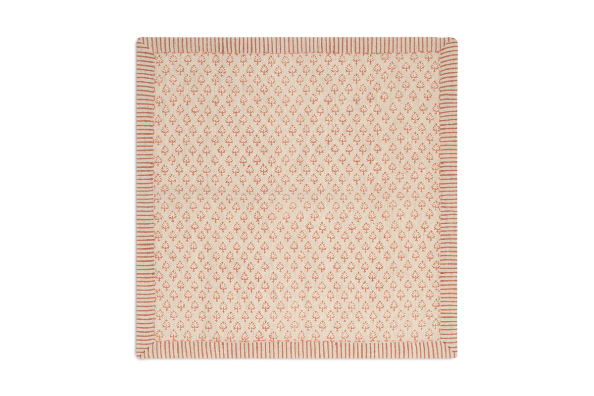 Inspired by Indian textiles, the nkuku Peplu Block Print Napkin Set in Terracotta features a beige background with a repeating red floral pattern and striped border, bringing traditional charm to your table. Set of 4.