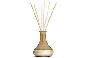 The nkuku Oakmoss & Rose Scented Reed Diffuser - Yellow is a decorative home fragrance featuring a hand-blown glass vessel with a gold and cream textured finish, designed with a wide base and narrow neck. Several thin, natural-colored reed sticks fan out at the top to disperse its delicate floral scent.