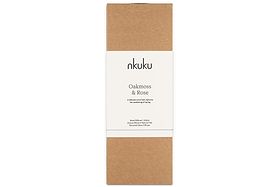 A rectangular brown box with a central white label displaying “nkuku” at the top and “Oakmoss & Rose” below, along with smaller print underneath. The minimal and natural packaging suggests it contains the Oakmoss & Rose Scented Reed Diffuser - Yellow from nkuku, likely featuring a floral fragrance presented in a hand-blown glass vessel.