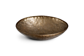The Malar Hammered Bowl - Brass by nkuku is a round, shallow bowl crafted from hammered metal with a warm brass finish. Its textured, dimpled surface creates an artisanal, handcrafted look, making it an elegant decorative centrepiece or display bowl. Shown here on a white background.