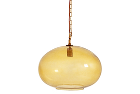 The Otoro Recycled Glass Pendant – Honey – Large Round by nkuku hangs from a gold chain with elegant brass fittings. Its smooth, glossy amber globe softly reflects the light, while the simple and minimalistic fixture inside remains visible. The light is off, set against a plain white background.