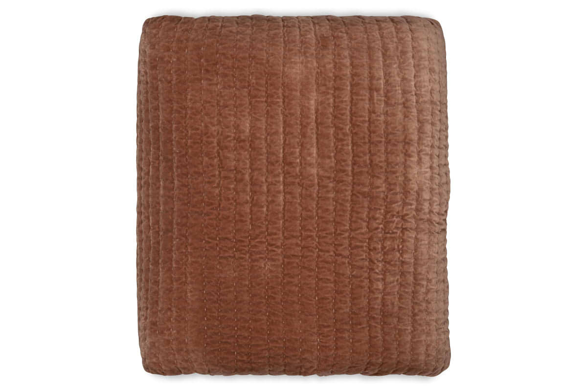 The Nidra Velvet & Linen Bed Quilt - Rust by nkuku is shown folded from above on a white background, featuring soft brown cotton velvet with a grid-stitched pattern—ideal for King or Super King beds.