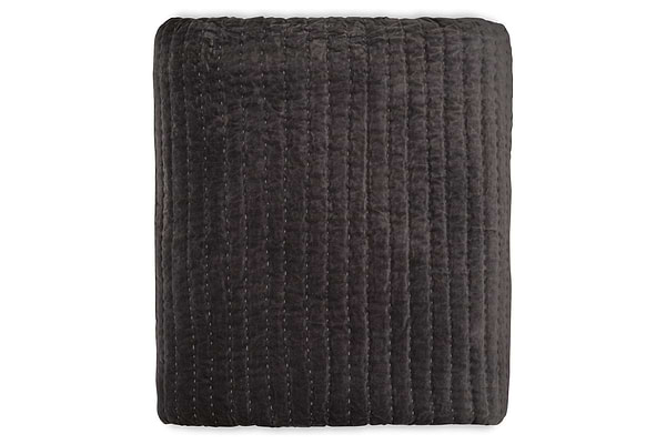 The Nidra Velvet & Linen Bed Quilt - Charcoal by nkuku is a folded, dark gray cotton velvet and linen quilt with vertical Kantha stitching, shown against a white background. Suitable for King and Super King beds.