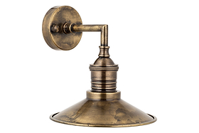 A close-up of the Najja Brass Wall Lamp by nkuku in Antique Brass showcases its elegant design and timeless appeal.
