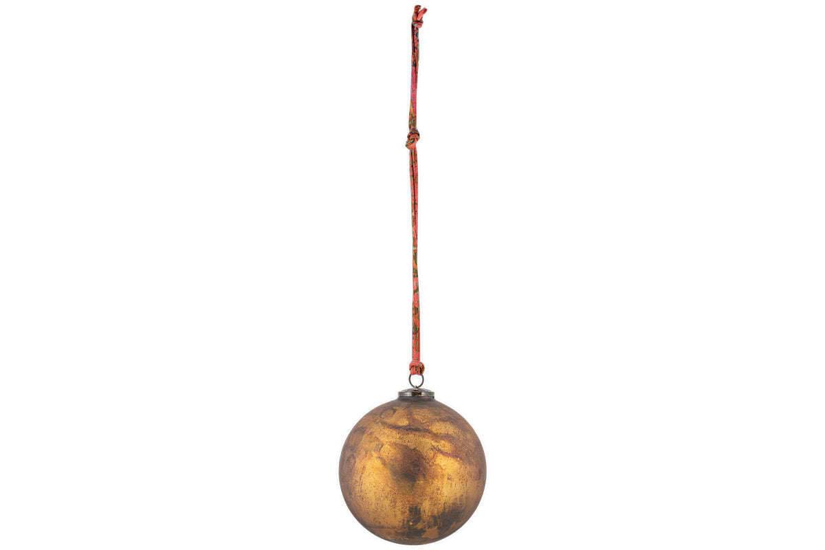 The nkuku Oko Giant Bauble in matt gold is an oversized, metallic oval ornament with a tarnished finish. It hangs from a red and orange string by a small loop, ideal for festive décor, and is shown against a plain white background.