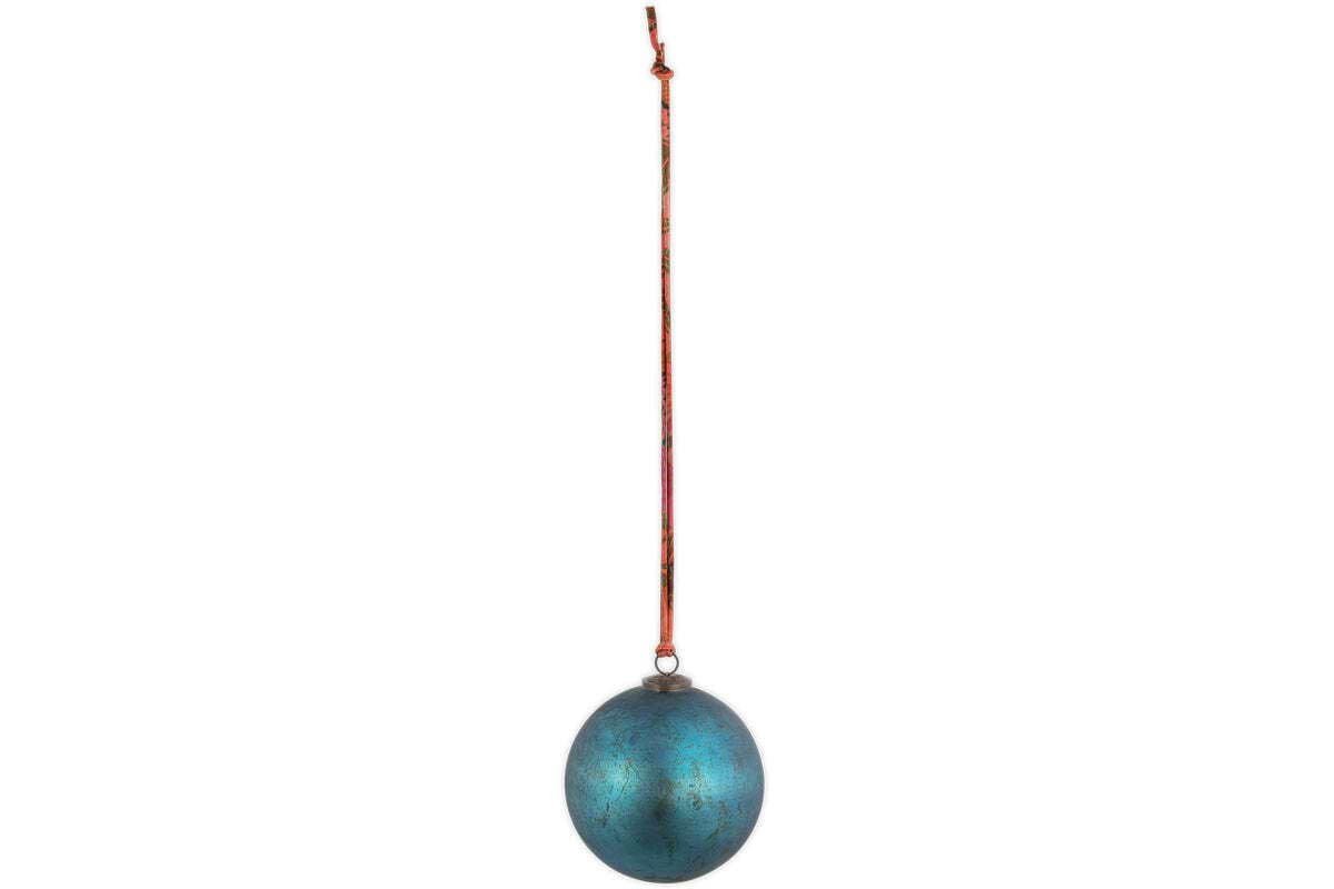 The nkuku Oko Giant Bauble - Matt Teal features a weathered blue-green finish and hangs from a thin red string against a white backdrop, offering a simple, centered look that’s ideal for festive displays or unique Christmas decorations.