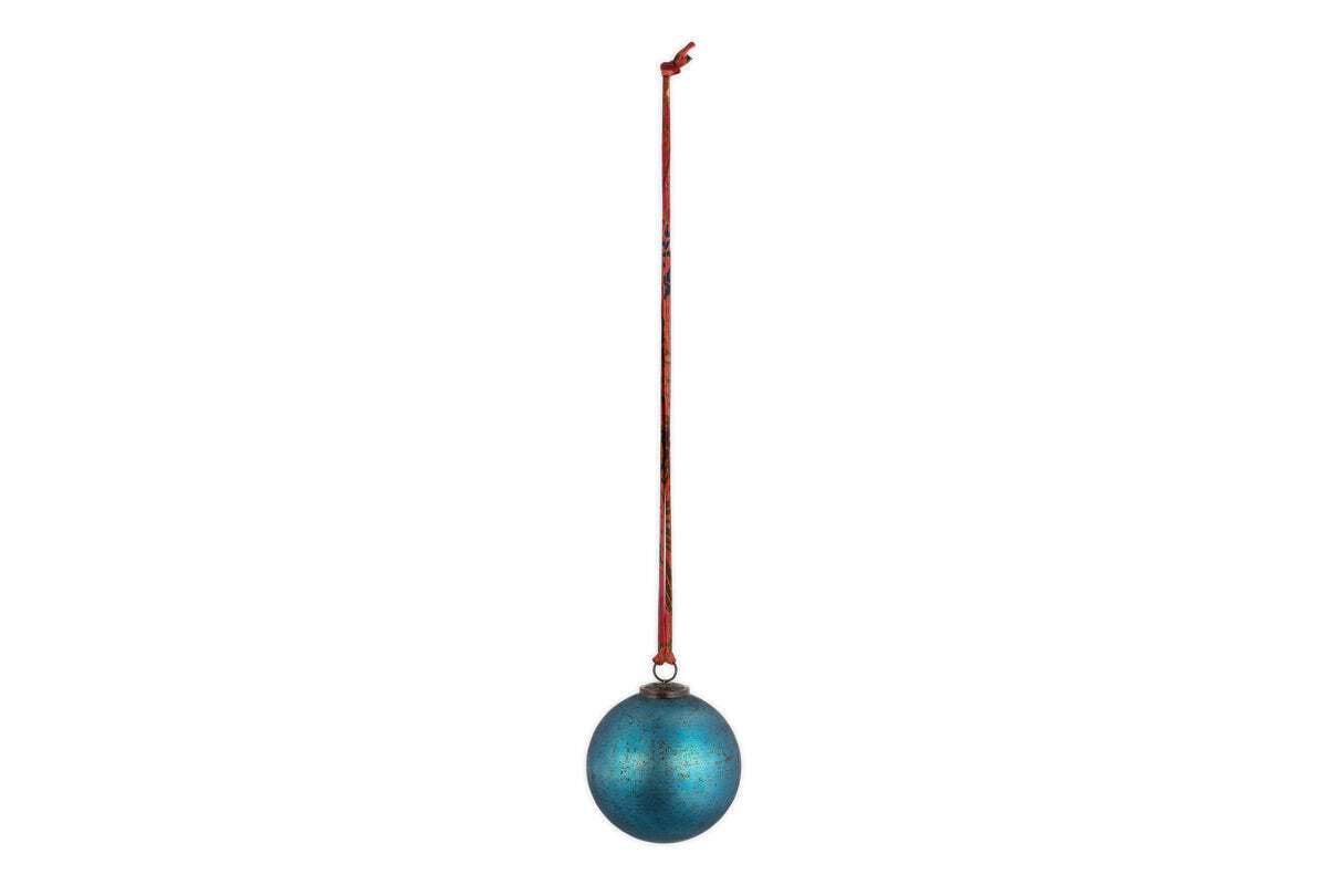 The nkuku Oko Giant Bauble in matt teal, shaped like an egg with a metallic finish, hangs from a long red ribbon against a white background—a simple yet elegant addition to any festive Christmas display.