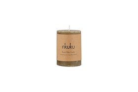 The Rustic Soy Blend Mini Pillar Candle - Olive by nkuku features a hand-poured, olive-toned soy wax blend, a textured finish, and a brown paper label. This mini rustic candle is shown against a white background.