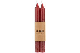 Two Rustic Soy Blend Dinner Candles in Dark Cherry by nkuku, hand-poured with a slightly textured finish, come as a set of 2 bundled together with a brown paper label that reads “nkuku Rustic Dinner Candles.”.