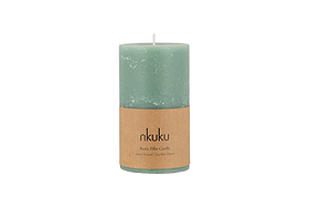 A small sage green Rustic Soy Blend Pillar Candle by nkuku, featuring a textured finish and a brown label, is shown against a white background.