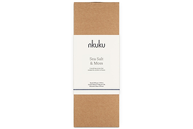 The nkuku Sea Salt & Moss Reed Diffuser comes in a brown rectangular cardboard box with a central white label, featuring minimalist, elegant packaging.