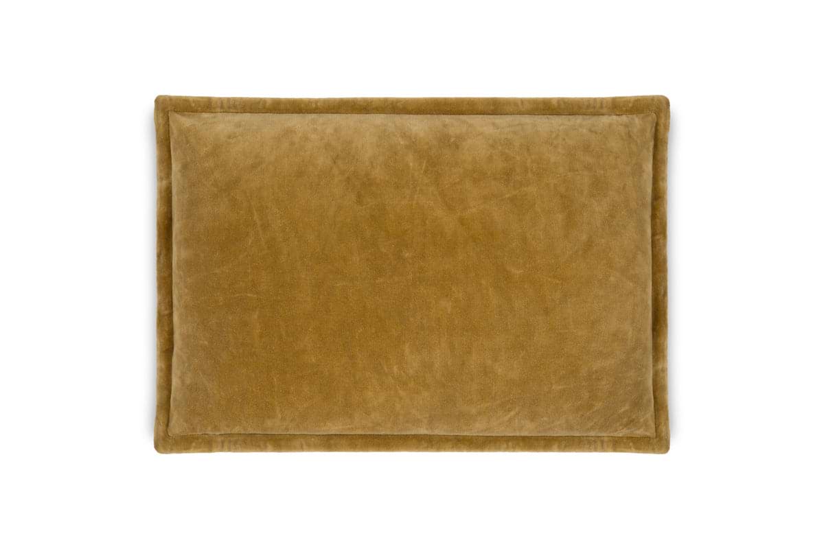 The Sela Velvet Cushion Cover - Ochre by nkuku is a rectangular cushion cover in mustard yellow with a soft, plush velvet texture, displayed on a white background.