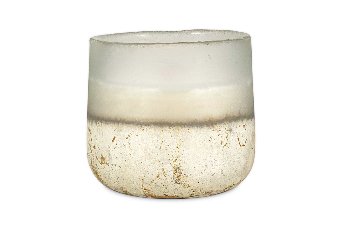 A translucent, frosted glass cup with a rounded shape and a gradient from clear to white with gold-speckled accents holds the nkuku Cardamom & Amber 3 Wick Scented Candle.