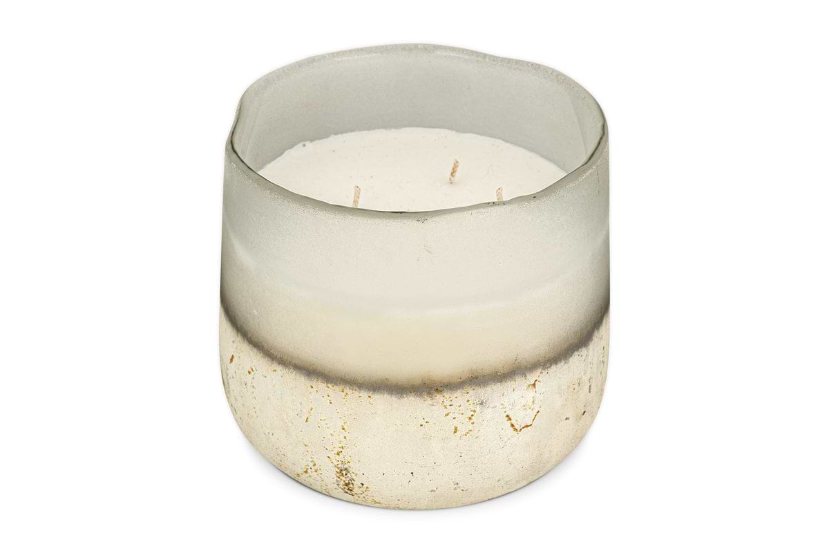 The Cardamom & Amber 3 Wick Scented Candle by nkuku features a translucent, textured white glass holder with frosted and gold-speckled accents, three wicks, and a warm aromatic fragrance.