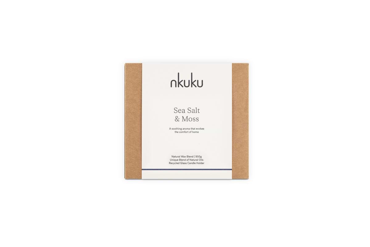 A nkuku Sea Salt & Moss 3 Wick Scented Candle in eco-friendly brown and white packaging features a bespoke, soothing fragrance and a recyclable clear holder. Expertly crafted in the UK.