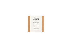 The nkuku Cedarwood & Fig 1 Wick Scented Candle, in minimalist packaging with a white label and brown kraft paper sides, fills the air with a warm honeyed fig aroma when displayed against a plain white background.