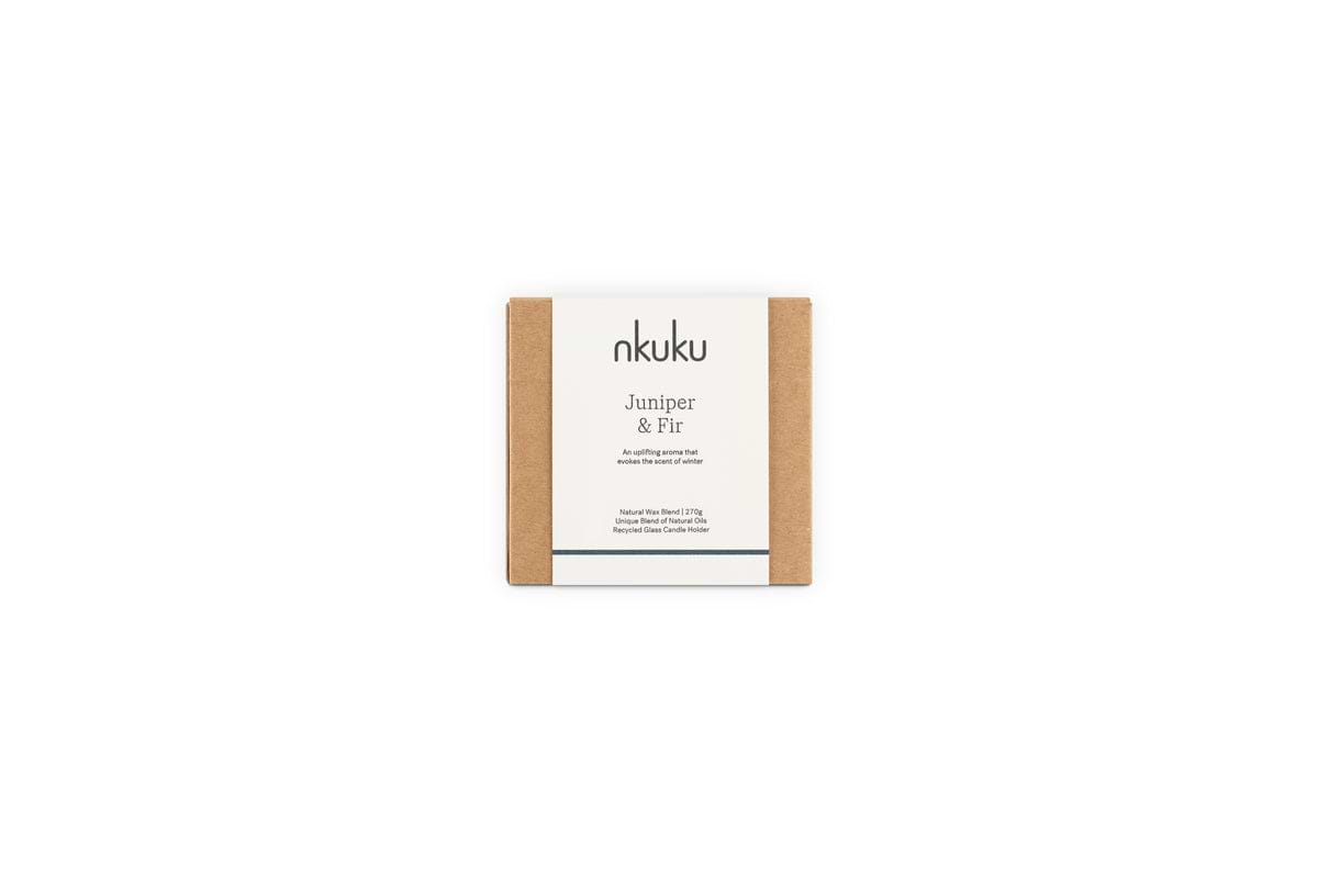 A small square box with a minimalist nkuku Juniper & Fir label in black on white holds the Juniper & Fir 1 Wick Scented Candle, offering elegant, sustainable reuse in its vessel.