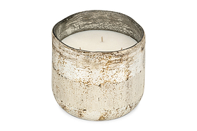The nkuku Juniper & Fir 3 Wick Scented Candle features a rustic, weathered silver container with a textured finish and uneven rim, creating an inviting atmosphere with its bespoke fragrance.