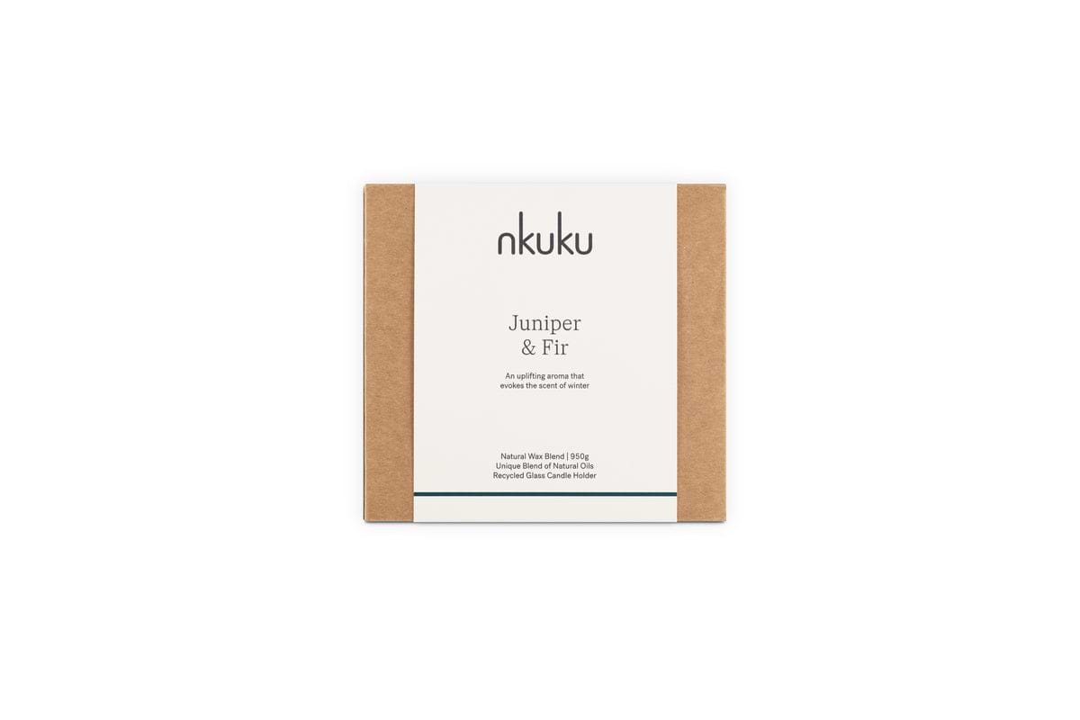 A square candle box with brown sides and a white nkuku Juniper & Fir 3 Wick Scented Candle label in black text on the front features a bespoke winter fragrance, displayed against a plain white background.