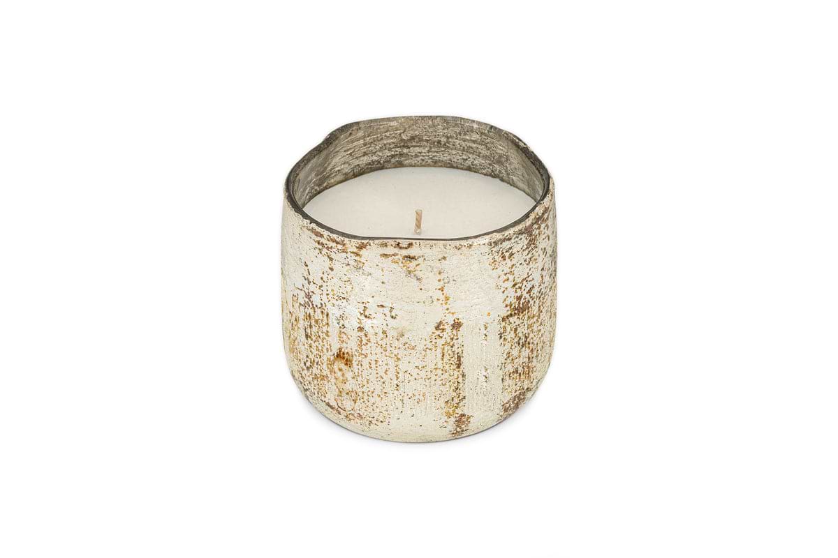 The nkuku Mandarin & Clove 1 Wick Scented Candle, presented in a distressed white metal container, releases a festive spiced mandarin aroma and is shown on a plain white background.