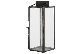 The Sia Mini Table Lantern by nkuku features a tall, rectangular black metal frame, clear glass panels, and a top handle—perfect for displaying a glowing tealight or for easy carrying and hanging.