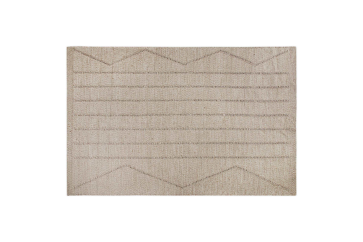 The nkuku Shanti Wool & Cotton Rug - Natural is a beige rectangular area rug with a textured surface and horizontal and zigzag line patterns, shown on a white background.