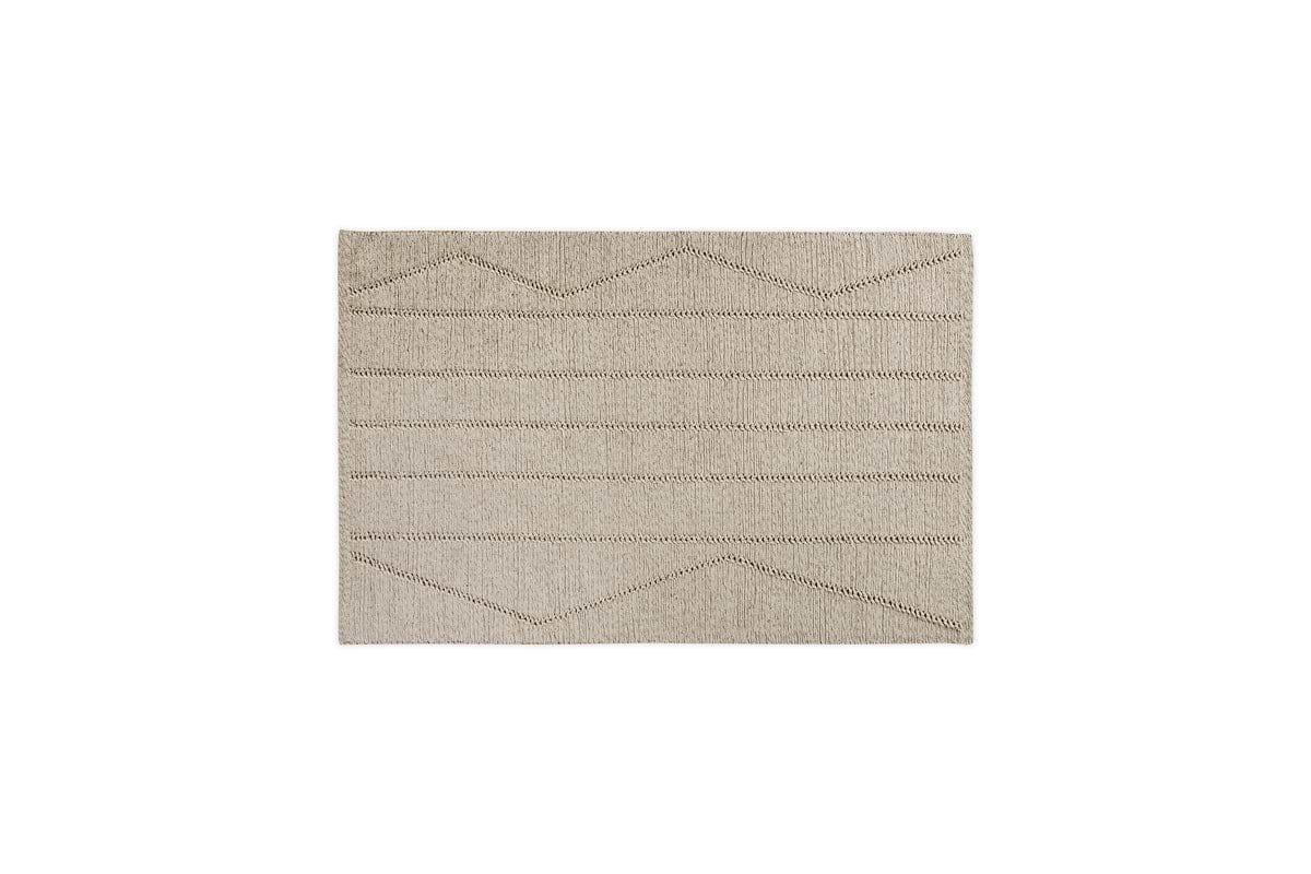 The Shanti Wool & Cotton Rug - Natural by nkuku is a square beige rug with subtle thin zigzag and horizontal brown patterns, set against a white background.