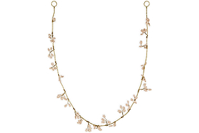 The Tanu Mango Wood Beaded Garland by nkuku features natural and brass beads spaced along a fine strand, evoking the charm of a festive garland. Elegant and nature-inspired, it adds warmth and handcrafted style to your decor.