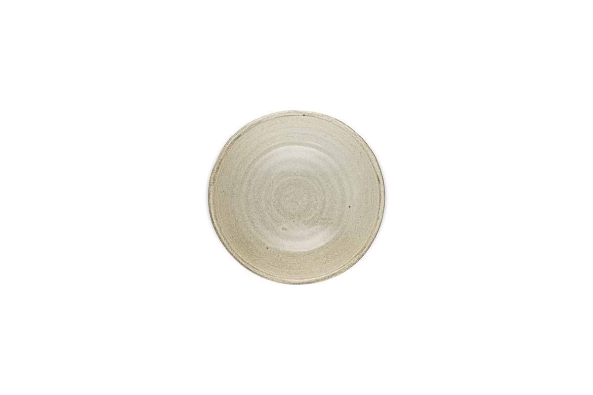 The Valinha Earthenware Cereal Bowl by nkuku features a textured spiral design and subtle reactive glaze in grey, adding depth and elegance.