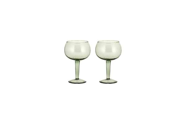 The nkuku Yala Hammered Gin Glass set includes two sage green glasses with long stems, displayed side by side on a white background.