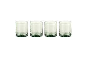 The nkuku Yala Hammered Tumbler - Sage Green (Set of 4) features clear, textured recycled glass tumblers with a subtle sage green tint at the base, shown side by side on a white background.