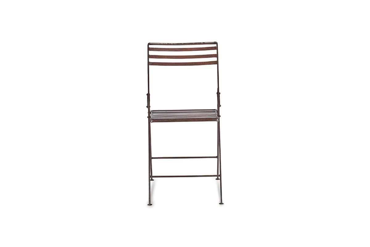 A front-facing nkuku Yealme Iron Bistro Chair with a dark brown finish features horizontal slats on the seat and backrest, slim sturdy legs with hinges and support bars, evoking classic industrial outdoor style. The background is plain white.
