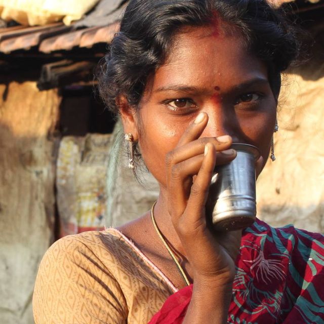 Young_woman_drinking_-_Mobile